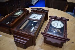 Three reproduction wall clocks