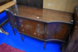 A reproduction Regency sideboard (strongbow) having shaped front with central three drawers
