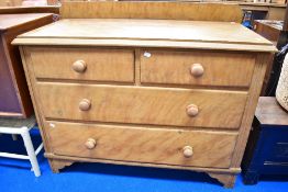 A Victorian scumbled pine low chest of two over two drawers
