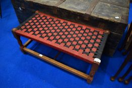 A strung footstool