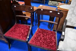 A pair of Victorian mahogany dining chairs having twist rail back