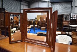A modern triptych dressing table mirror