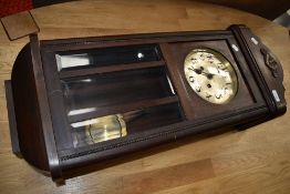 An early 20th Century mahogany cased wall clock