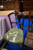 A Victorian mahogany rail back salon chair having upholstered seat