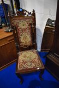 A 19th Century mahogany hall chair having tapestry style back and seat