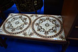 A vintage teak and tiled top coffee table