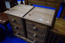 A pair of modern pine bedside drawers