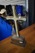 An altar style crucifix in oak with cream blue and gilt detailing
