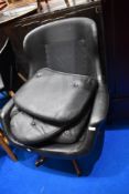 A vintage vinyl swivel easy chair