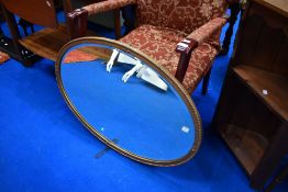 A gilt frame oval wall mirror, approx. 80 x 55cm