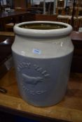A large ceramic planter modelled as a milk churn