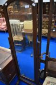 A vintage oak cheval mirror