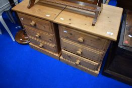 A pair of modern pine three drawer bedside chests