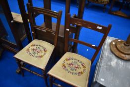 A pair of Edwardian mahogany bedroom chairs