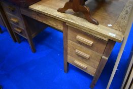 An early 20th Century golden oak office desk
