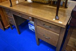 A vintage golden oak office desk