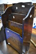 An early 20th Century oak paper rack