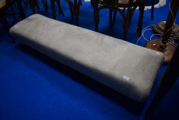 An upholstered stool of wide proportions, possibly for kneeling, width approx. 137cm