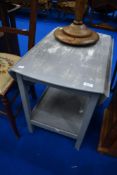 A shabby chic tea table with drop flaps