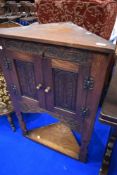 A Priory style corner cabinet