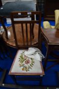 An Edwardian mahogany bedroom chair