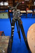 A vintage tripod, possibly military or theodolite