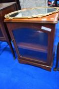 A modern cherry effect music cabinet