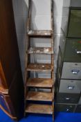 A set of vintage wooden step ladders