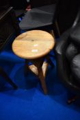 An adjustable pine stool
