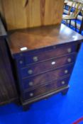 A reproduction Regency narrow chest having fold over writing top, width approx. 59cm