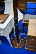 A traditional mahogany standard lamp, with shade