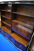Two reproduction regency style mahogany bookshelves