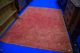 A modern wool rug, in orange tones, approx. 230 x 160cm