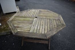 A stained wood garden table (folding)
