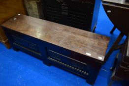 A traditional hardwood bedding box of small proportions having carved decoration to panels, width