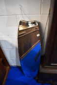 A vintage frameless wall mirror