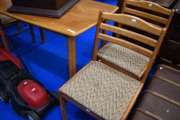 A modern table and four chairs, in the vintage style