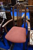 A vintage stained frame armchair