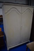 A vintage double wardrobe labelled Tibbenham of Ipswich