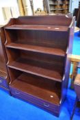 A modern Rossmore waterfall bookshelf with drawer to base