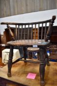 A Child's Windsor armchair having low ba