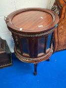 A modern hardwood cocktail cabinet with tray top