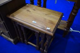A modern pine nest of three tables