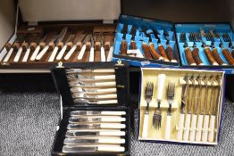 A good selection of vintage cutlery including a cased set of Mother of pearl handled fruit cutlery