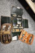 Three early 20th century Gentlemans toiletry sets including Bakelite, Ebony and chrome plated.