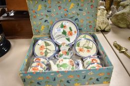 An early 20th century Japanse porcelain childrens toy or dolls tea set with original box.