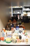 A selection of mostly modern ceramic model houses and cottages with a Staffordshire flatback