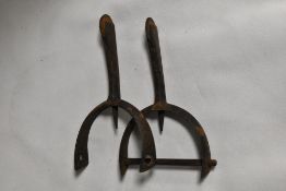 A pair of antique boot spurs for horse riding.
