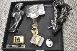 Two Victorian cast iron door knockers including a naturalistic ivy design and one as a girl carry