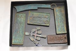 A selection of reproduction cast metal Chinese seal tokens, and plaques including a lucky money tree